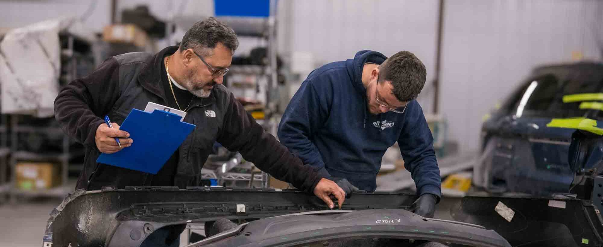 estimator and technician going over parts for vehicle – apex auto center estimator and technician going over parts for vehicle - apex auto center